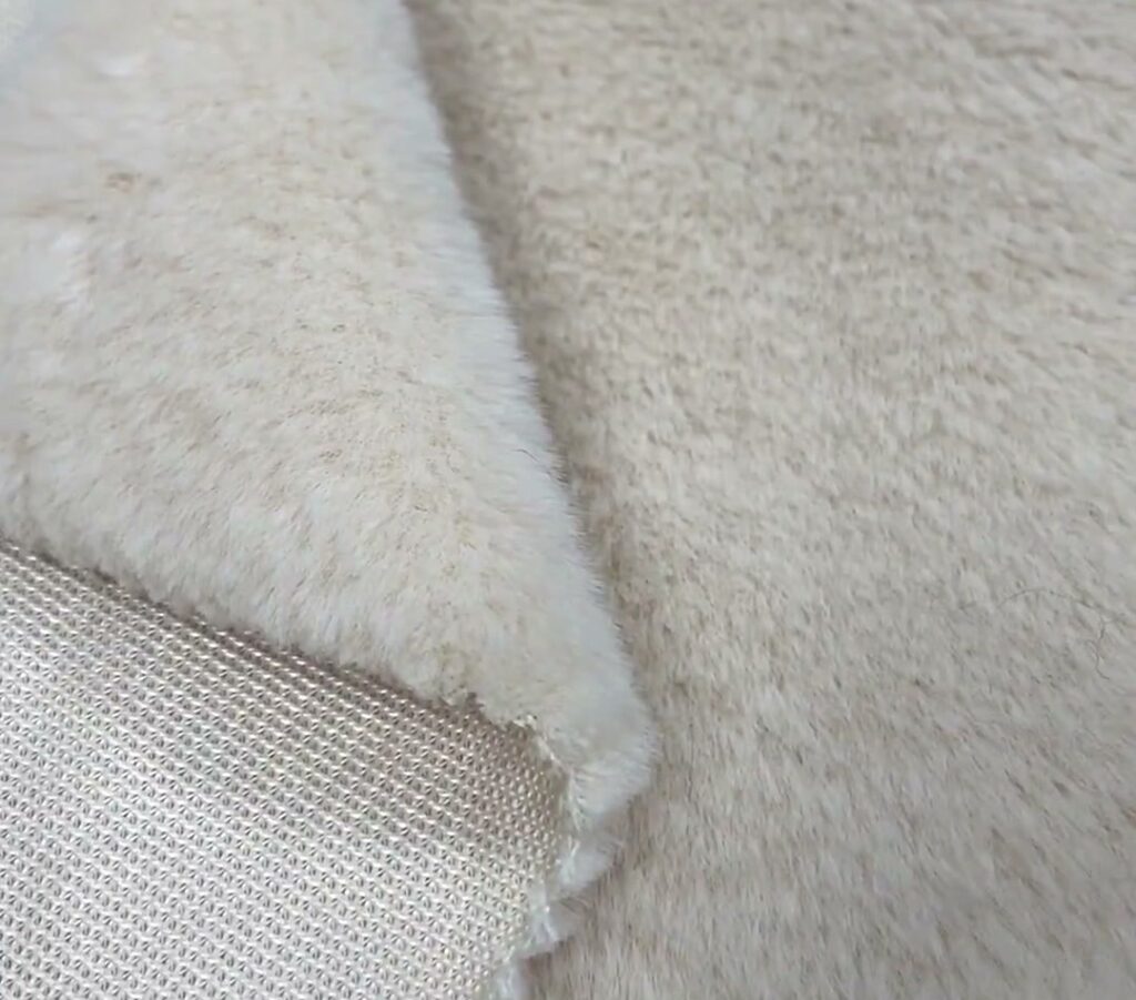 SM-065 single-sided Arctic fleece reference — Reference 7 — face and knitted-back construction close-up